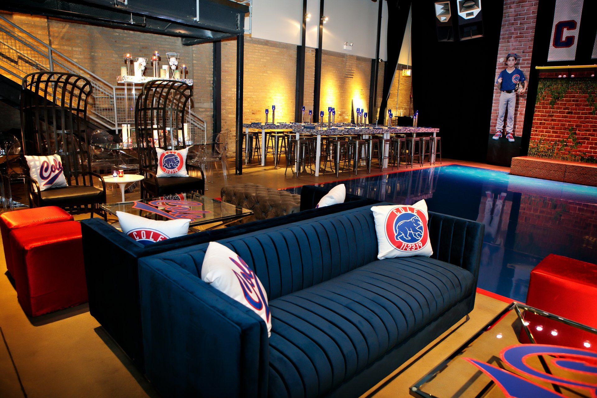 A living room with a blue couch and a swimming pool