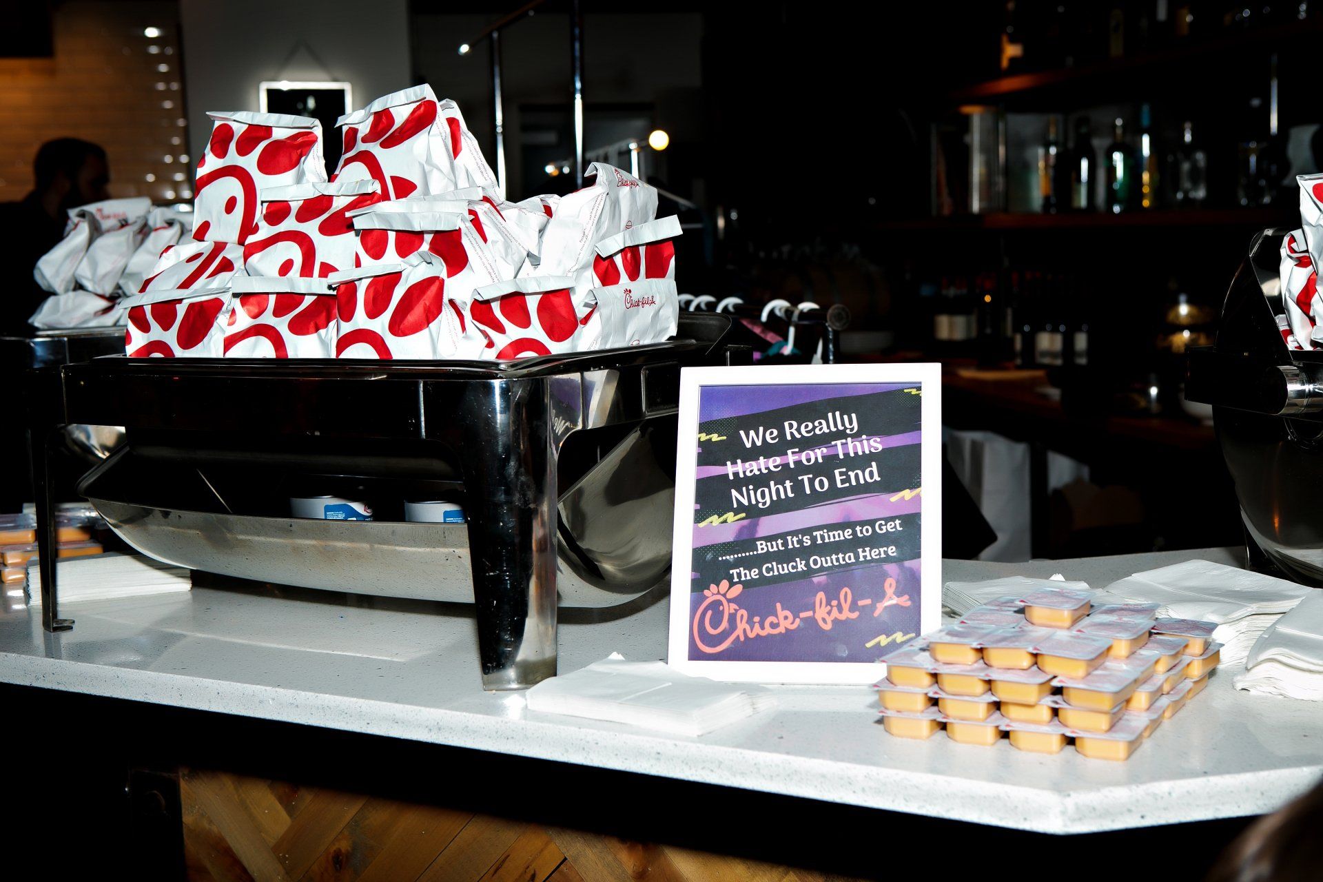 A table with a sign that says chick-fil-a on it