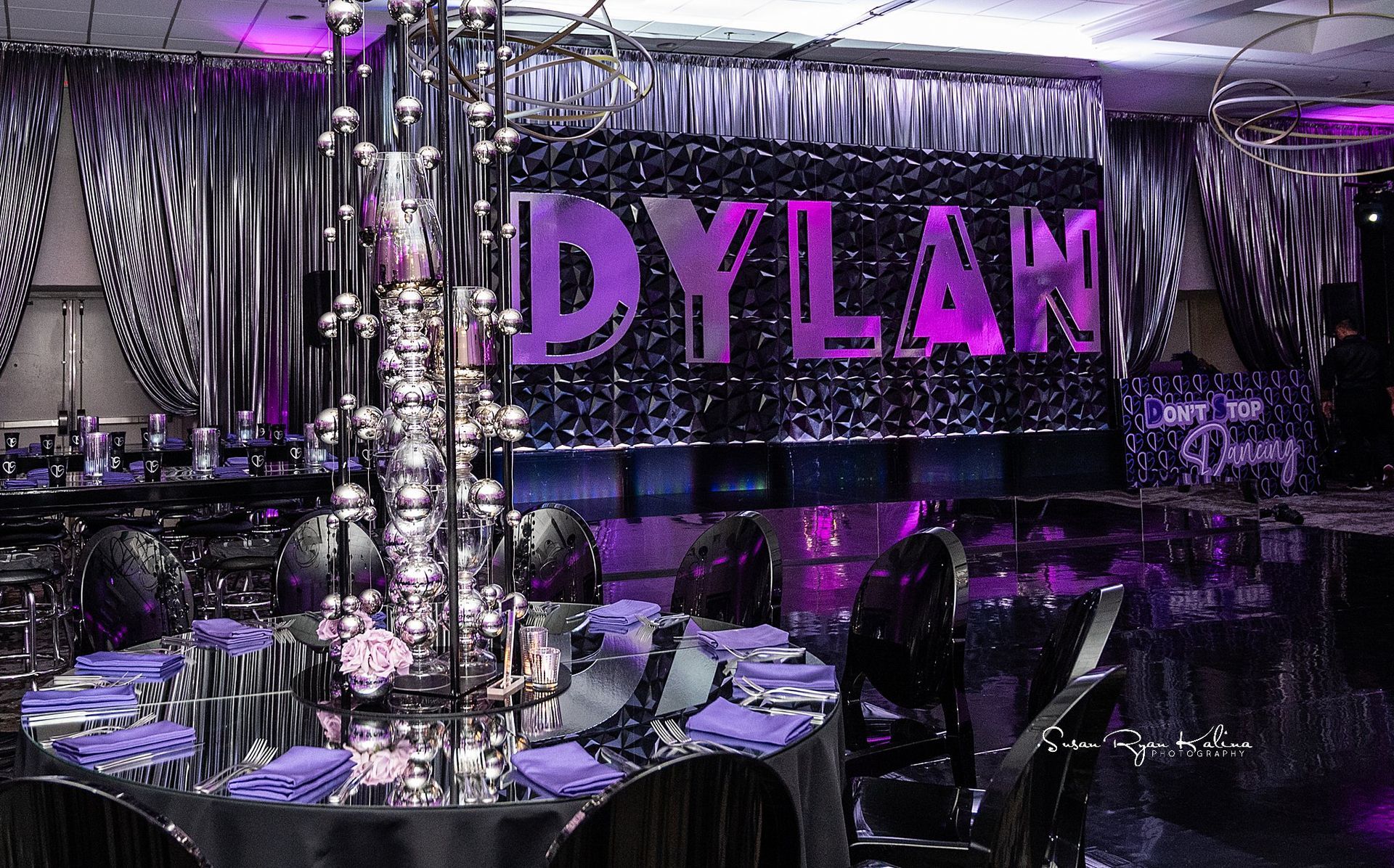 A room with tables and chairs and a sign that says dylan