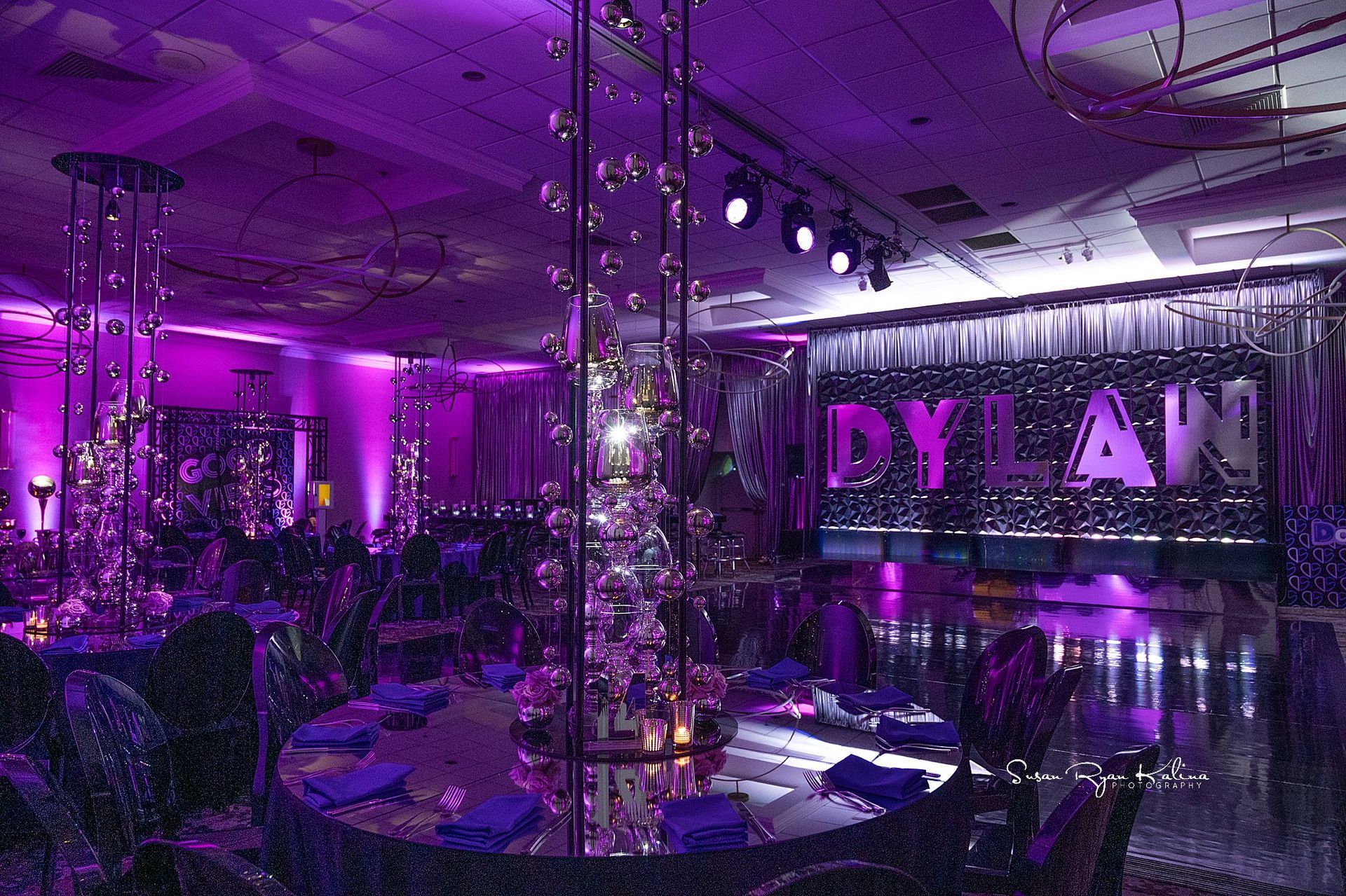 A large room with purple lights and a sign that says dylan