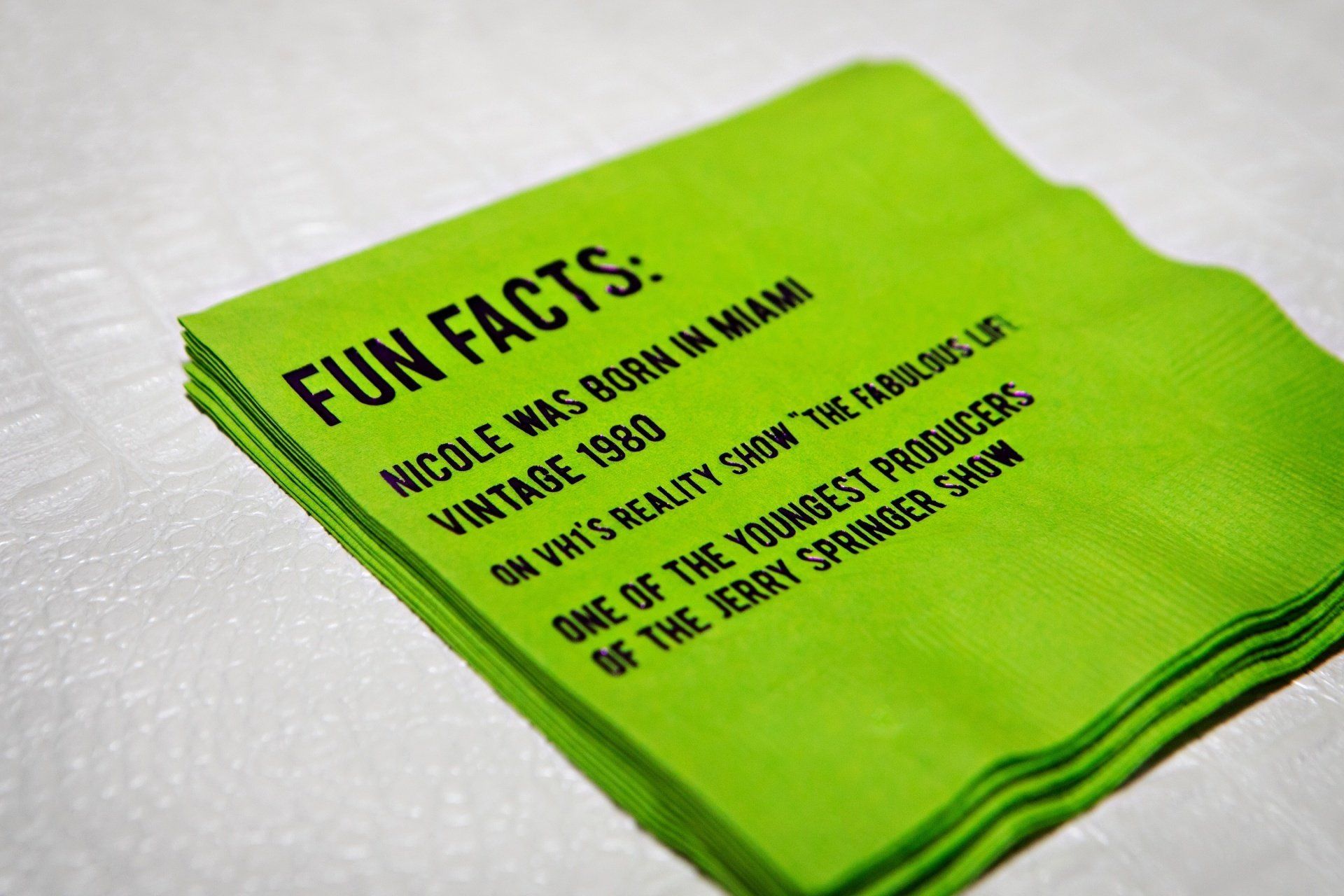 A green napkin that says fun facts on it