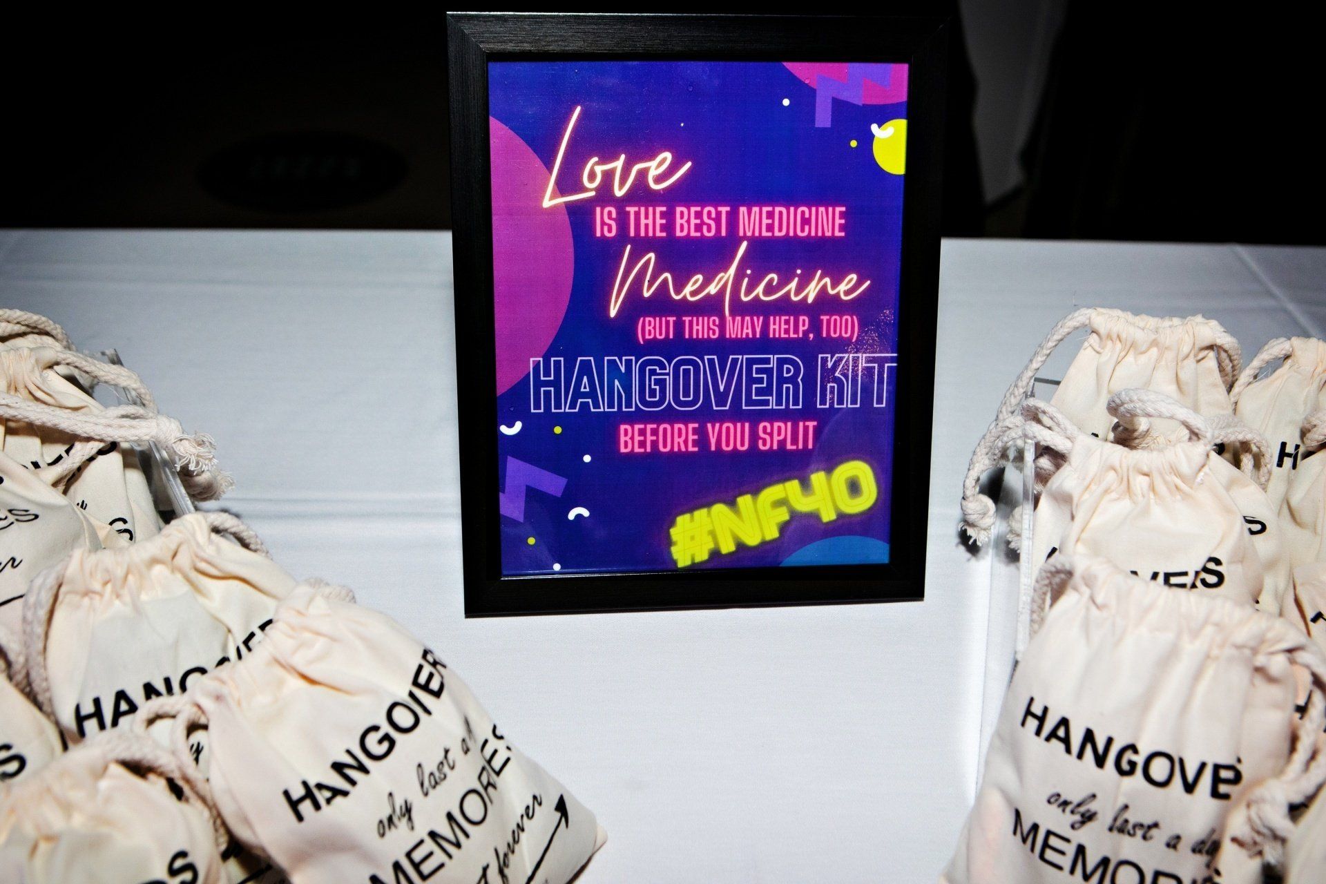 A sign that says love is the best medicine hangover kit