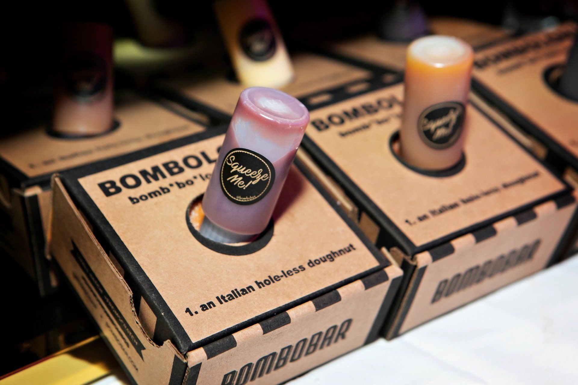 A box with a shot glass in it that says bombobar