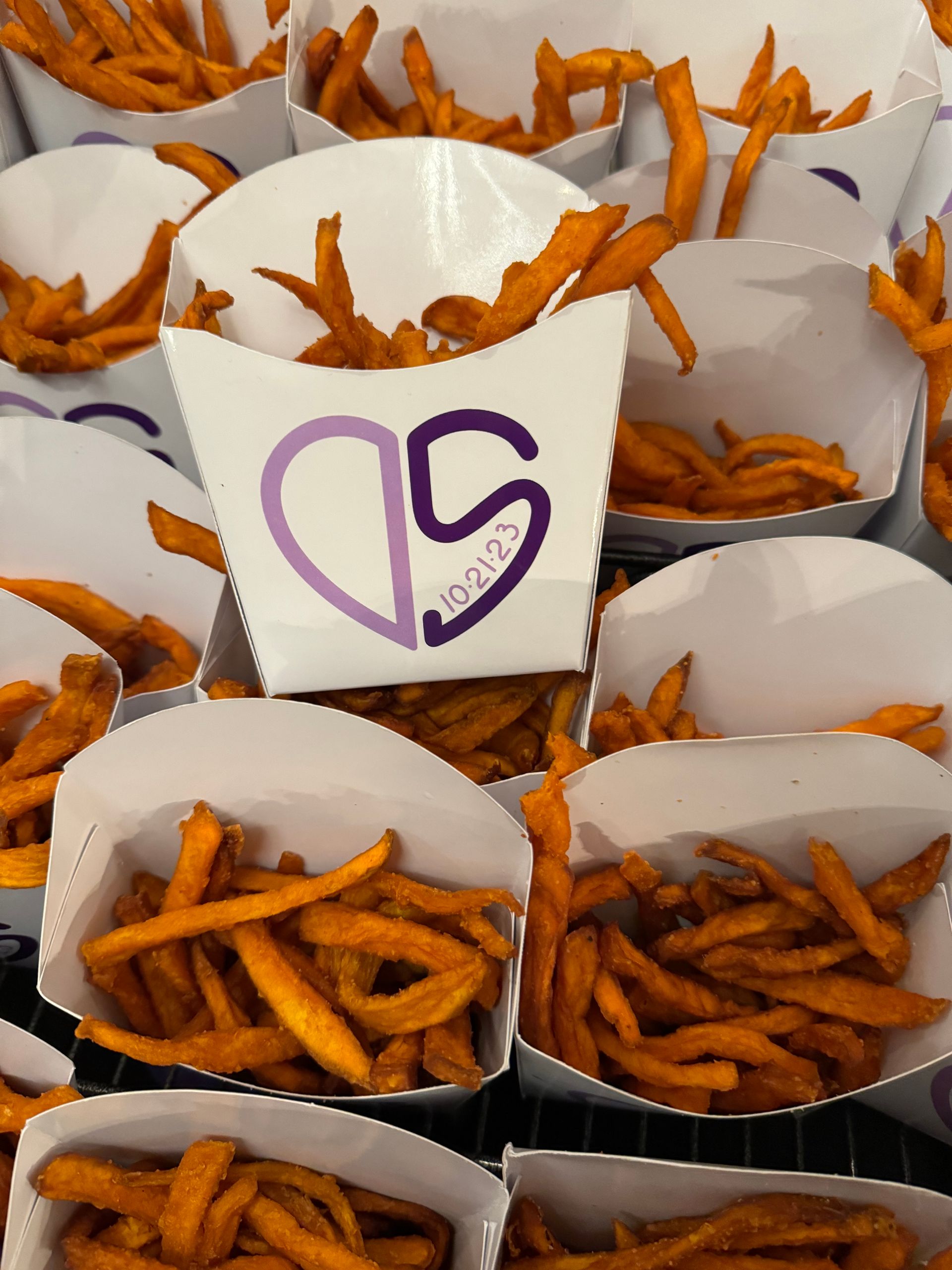 A box of sweet potato fries with a heart on it