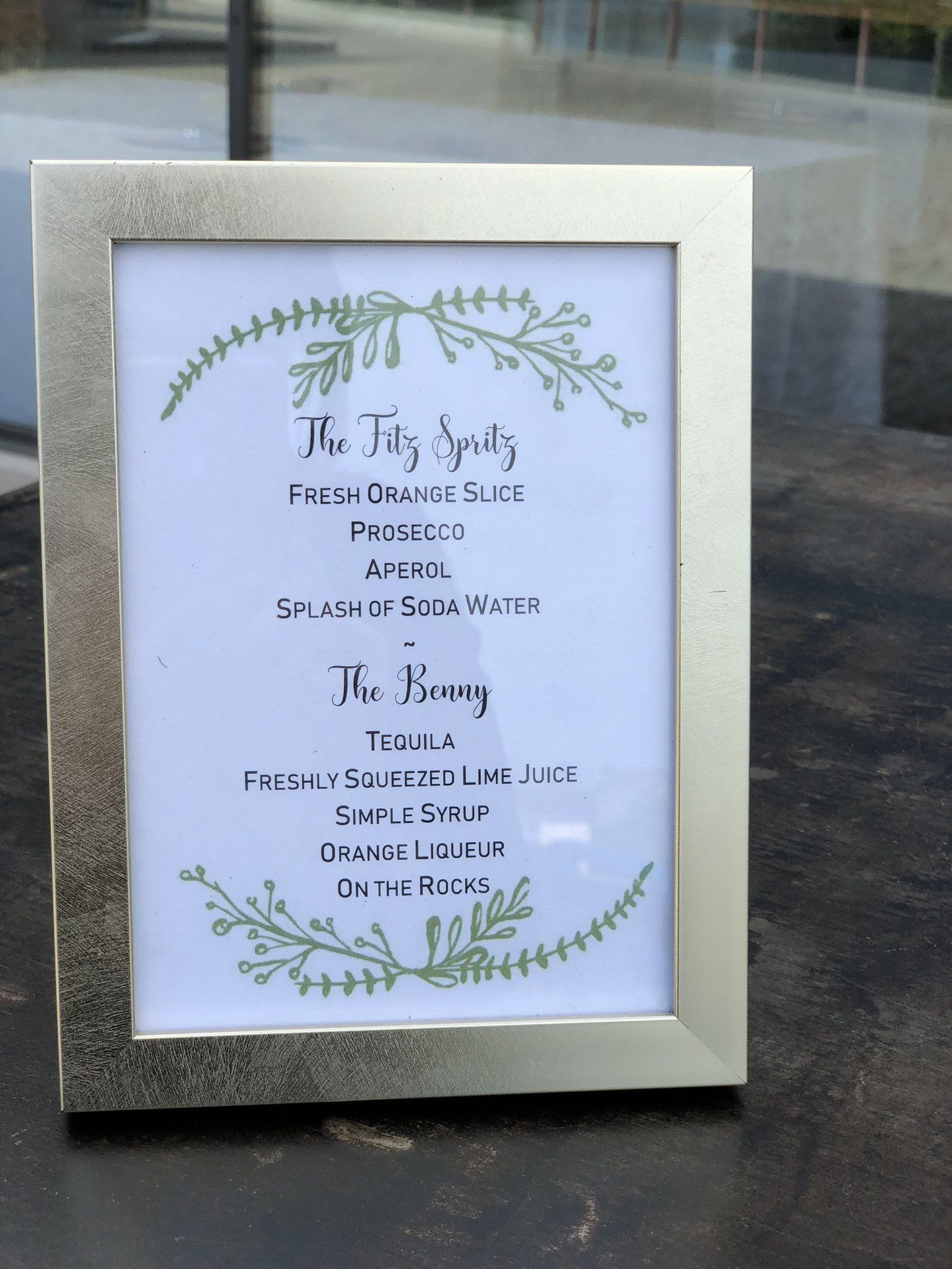 A framed sign that says the king on it