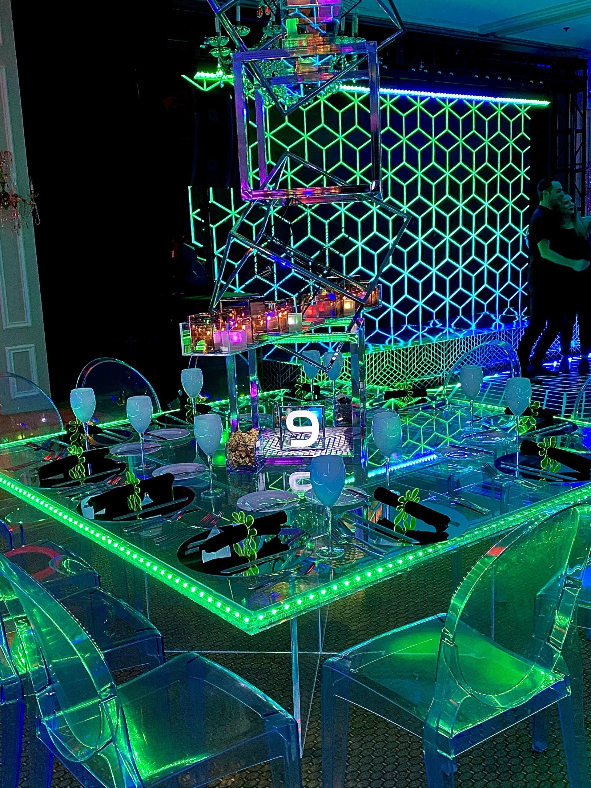 A table and chairs are glowing in the dark.