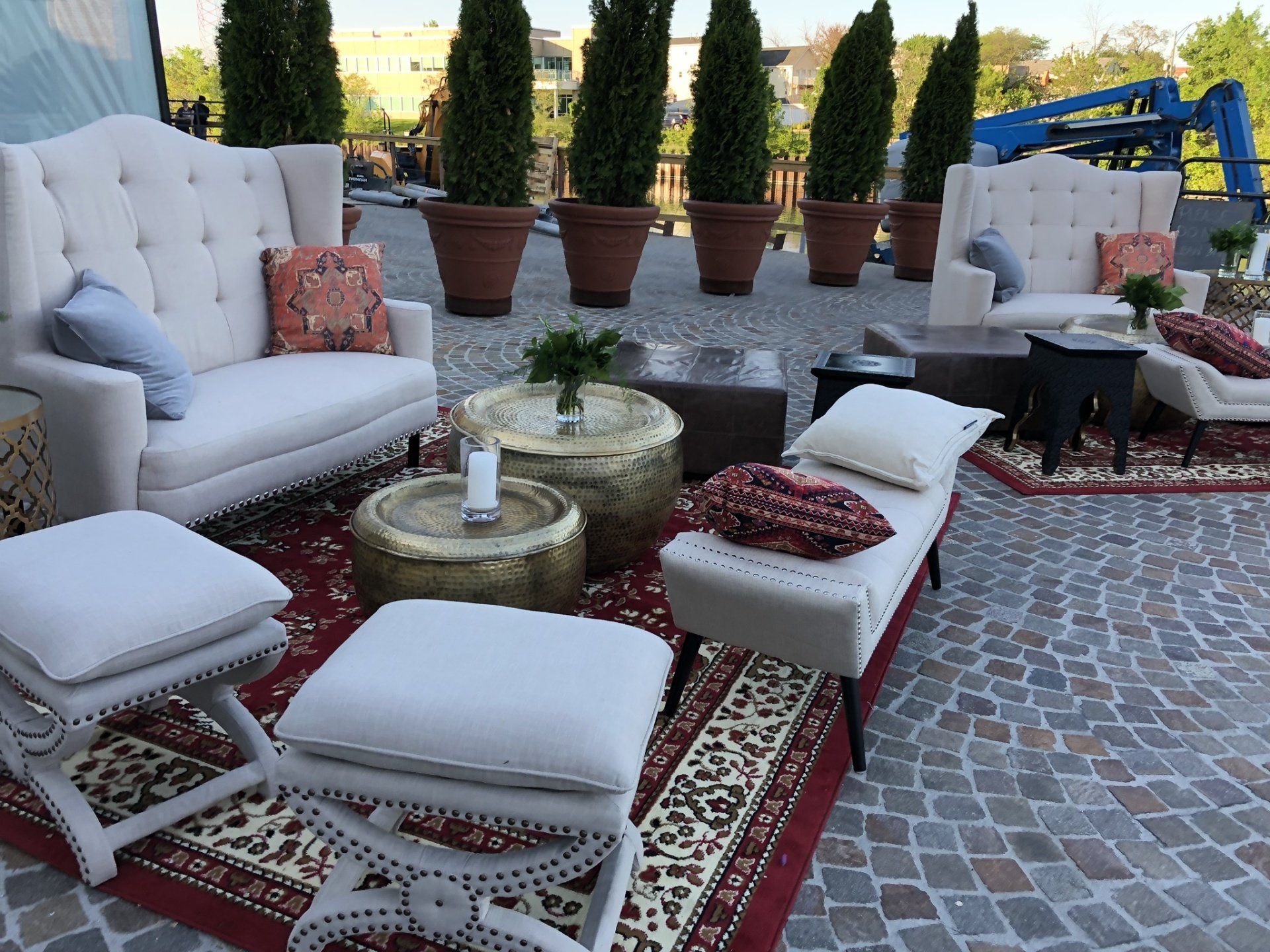 A patio with a lot of furniture and potted plants