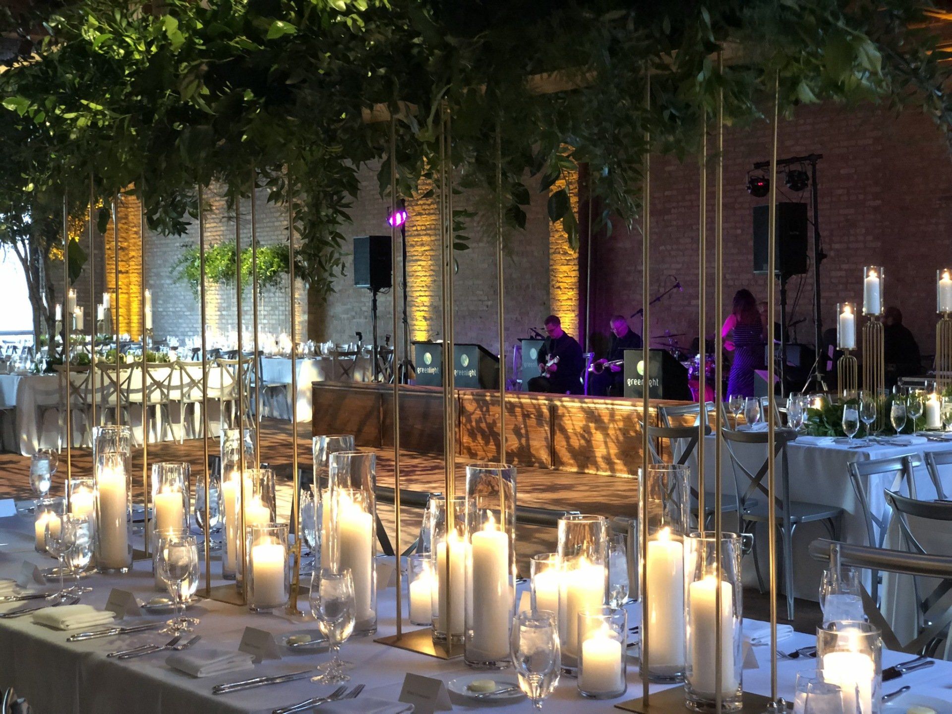 A long table with a lot of candles on it