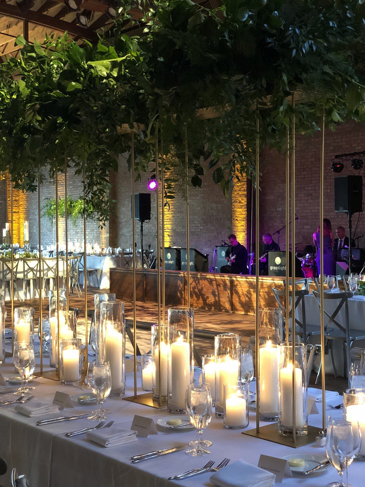 A long table with candles and flowers on it
