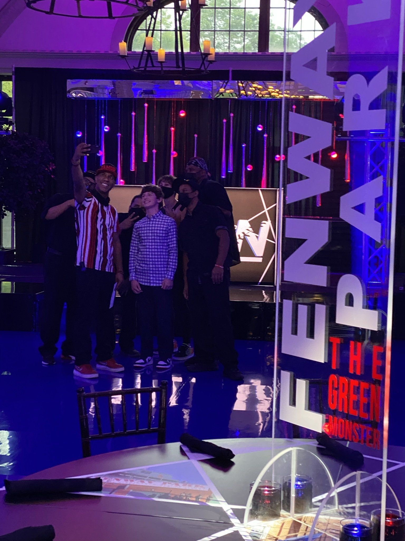 A group of people are standing in front of a sign that says pennsylvania