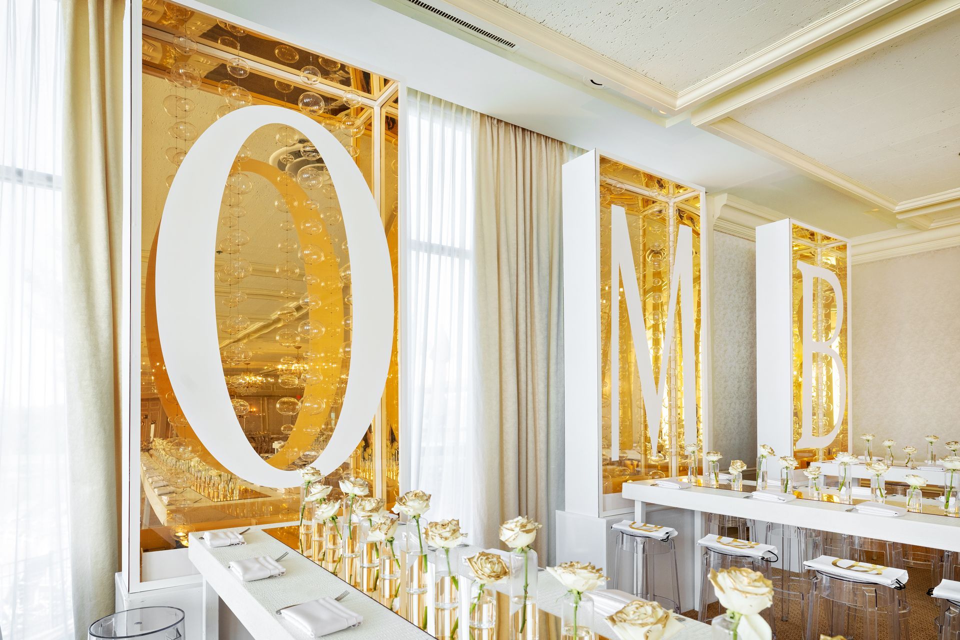 A large room with tables and chairs and a sign that says one