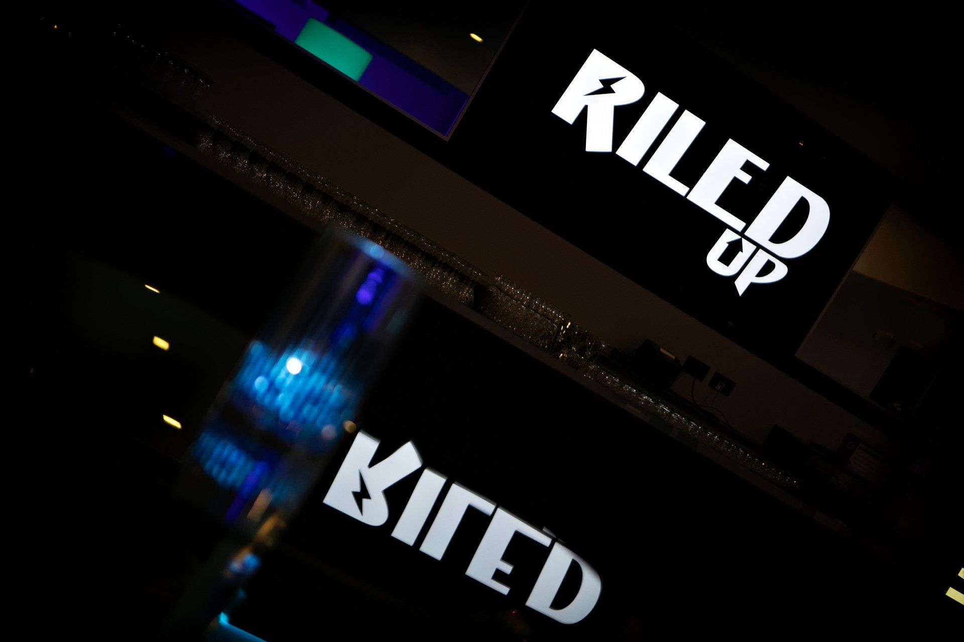 A sign that says riled up on it