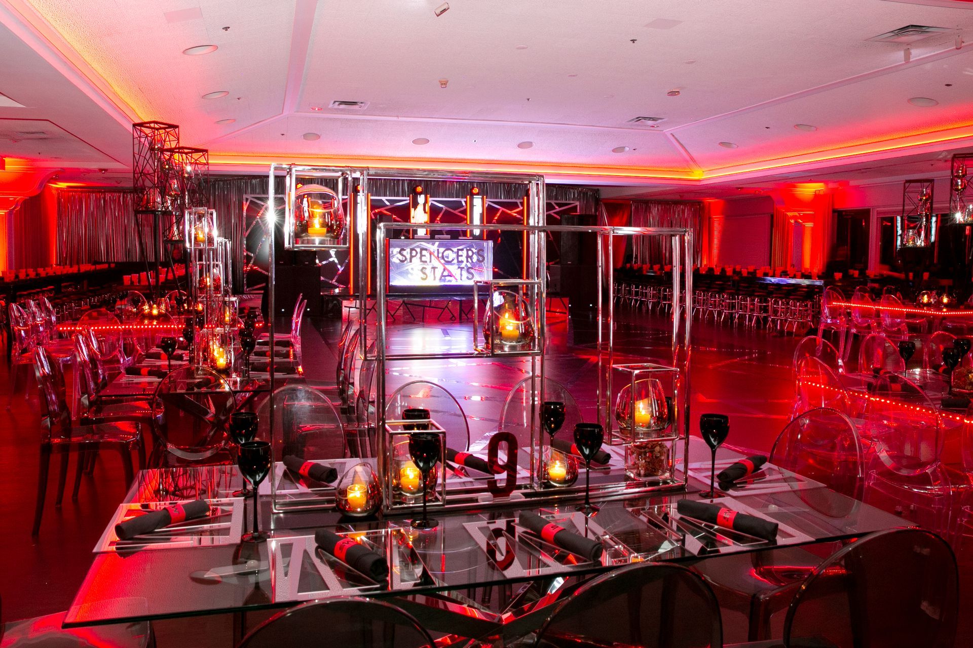 A large room with a table and chairs set up for a party.