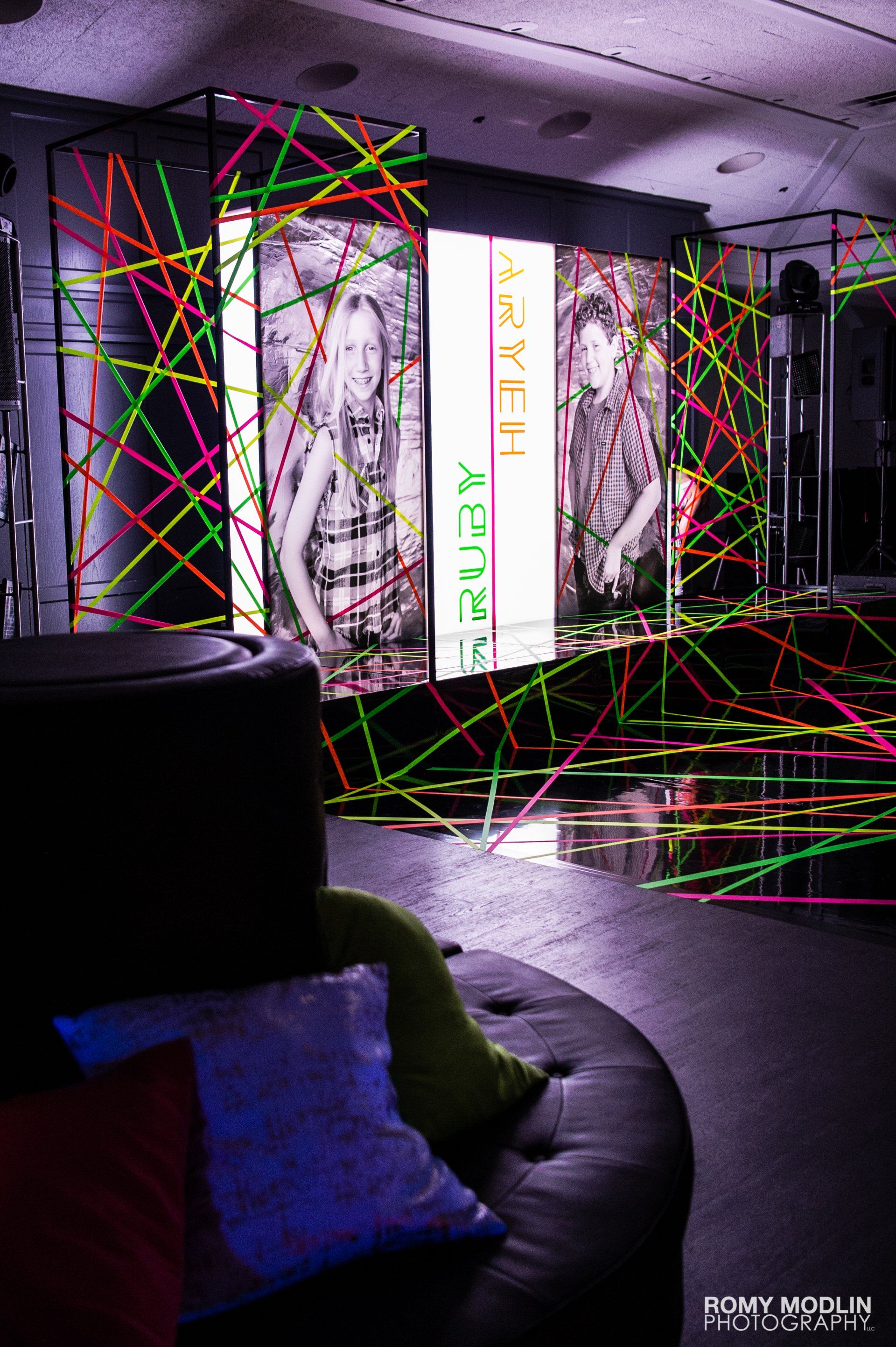 A room with a lot of neon tape on the floor and walls