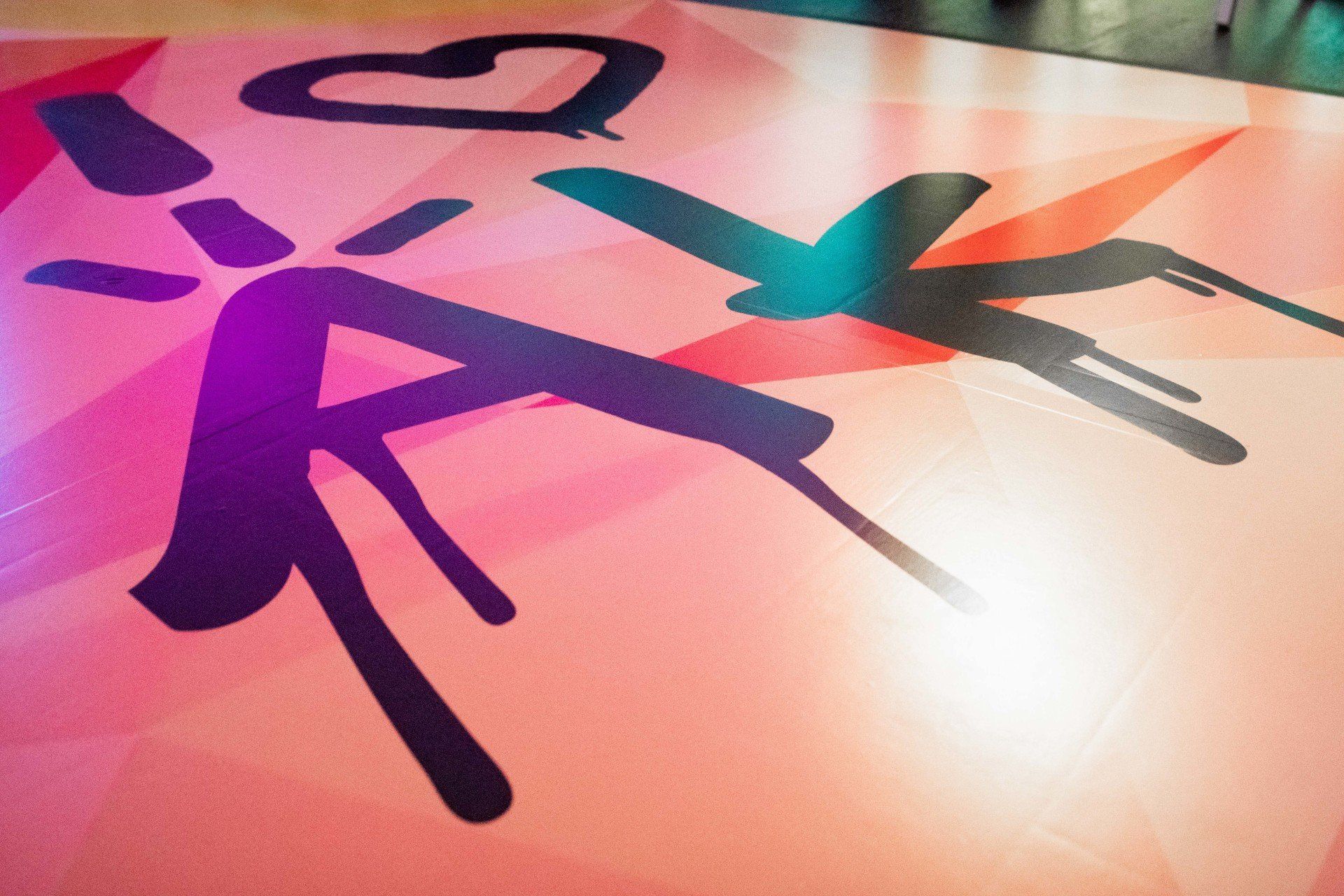 A silhouette of a person with a heart on the floor