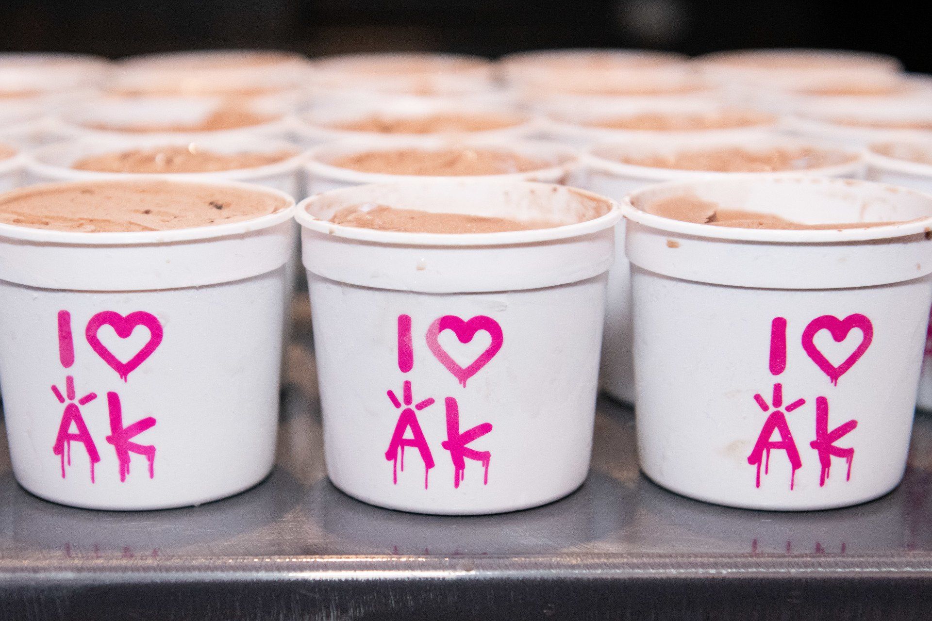 A row of cups with i love ak written on them
