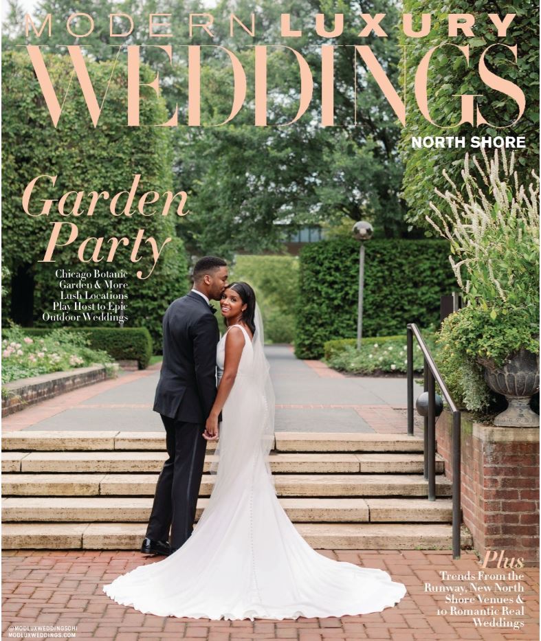 A bride and groom are posing for a picture on the cover of a wedding magazine.