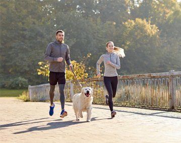 A young couple running after our chiropractic services in Orrville, OH.