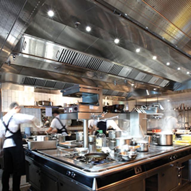 A Kitchen With a Lot of Pots and Pans on the Stove — Commercial Kitchens Direct in Shellharbour, NSW