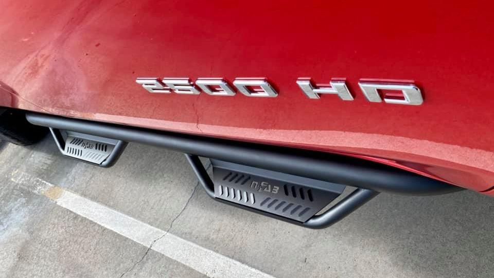 A red truck with NFAB step boards.