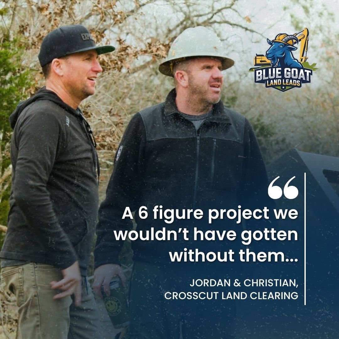 A yellow tractor is cutting down trees in a field.