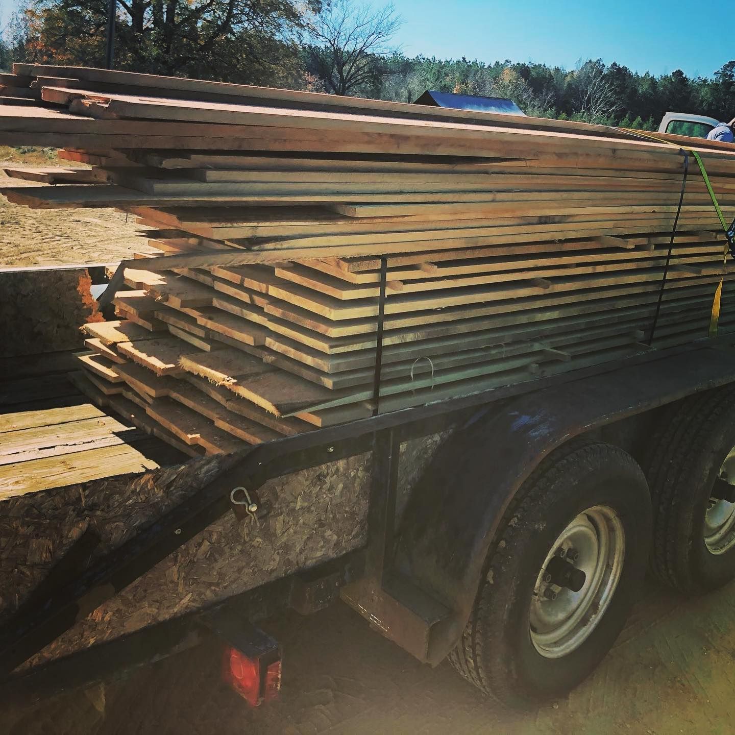A trailer with a bunch of wood on it