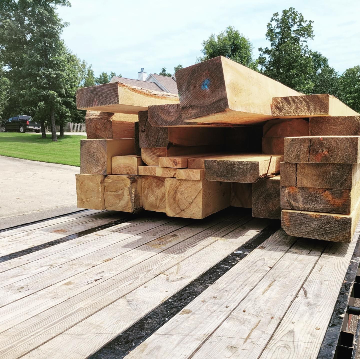 A stack of wood sitting on top of a wooden deck