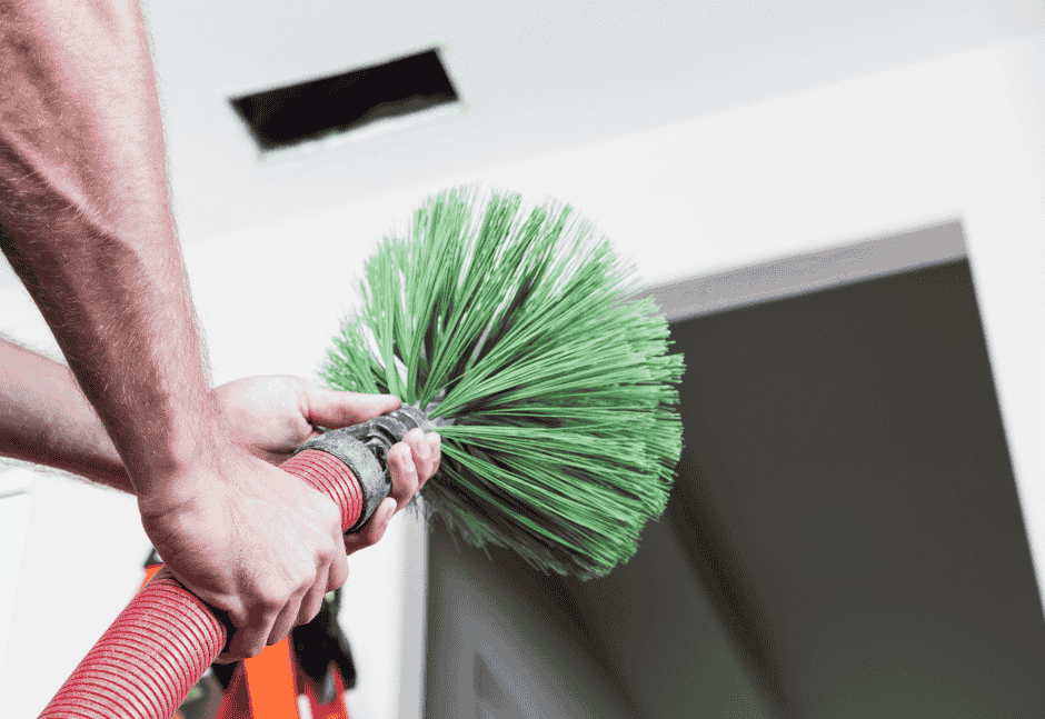 Technician using Duluth Duct Cleaning Equipment