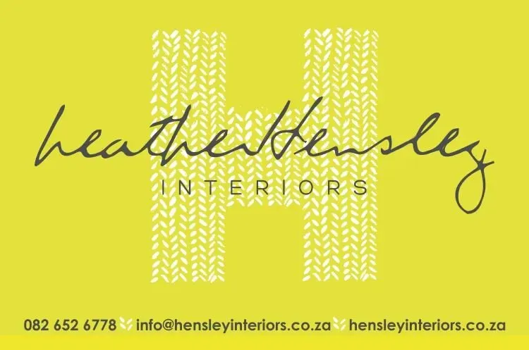 A yellow business card for heather bensley interiors