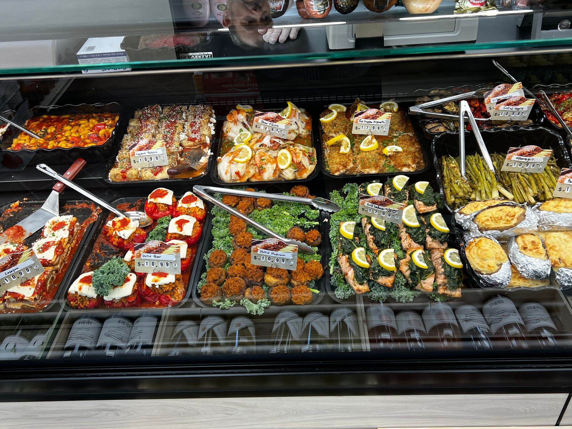 A display case filled with lots of different types of food