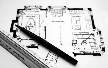 Floor plan sketch with a ruler and pen.