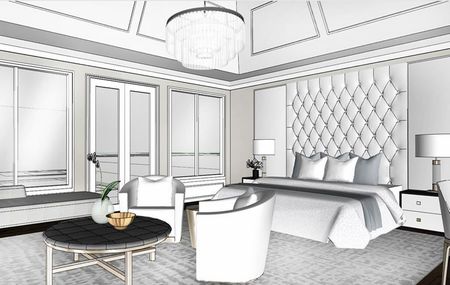 Elegant bedroom with a tufted headboard, two armchairs, and a round coffee table; light and airy.