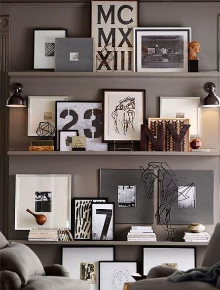 Shelves with framed art and decorative objects in a neutral color scheme.