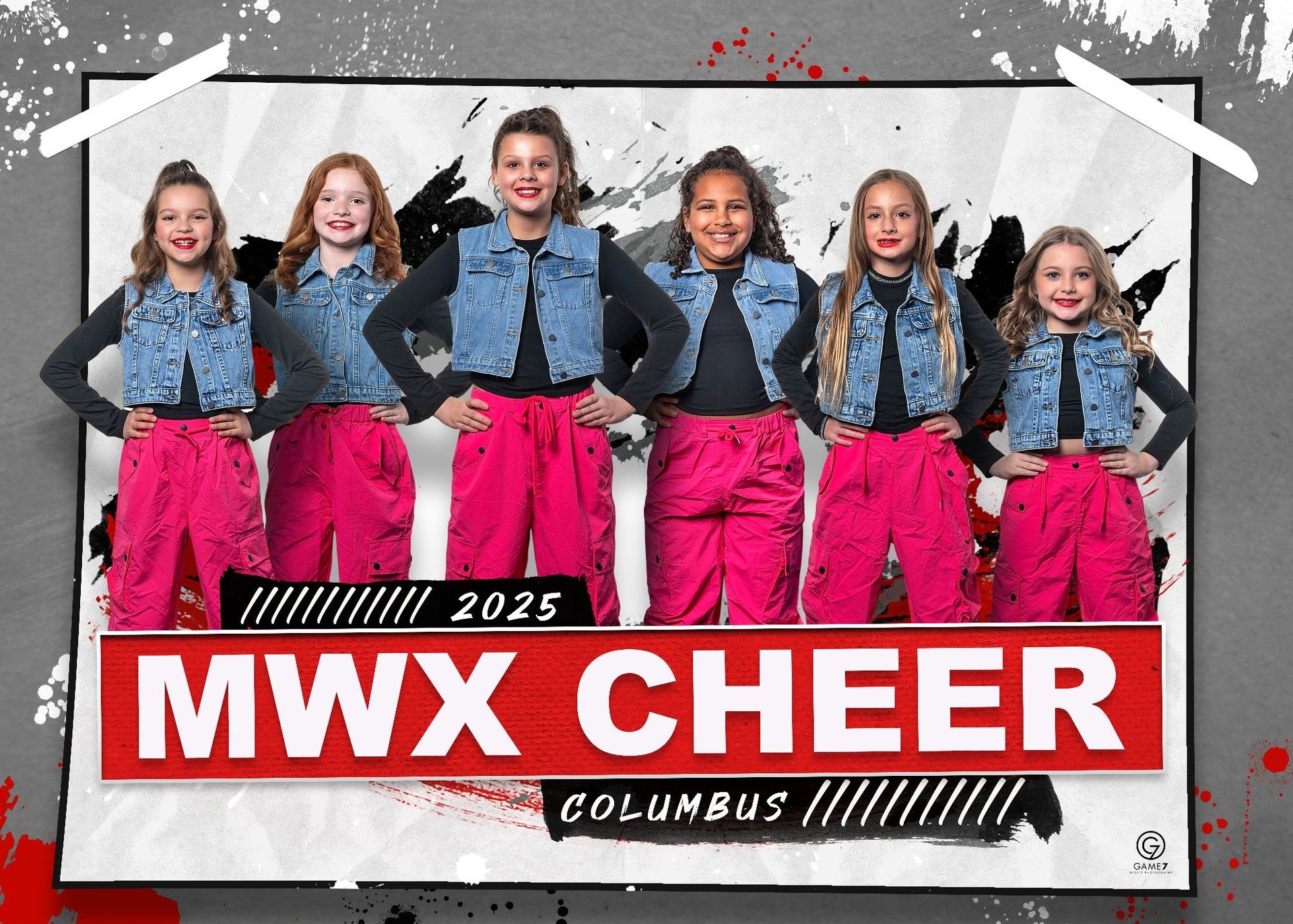 A group of young girls are standing next to each other in front of a sign that says mwx cheer.