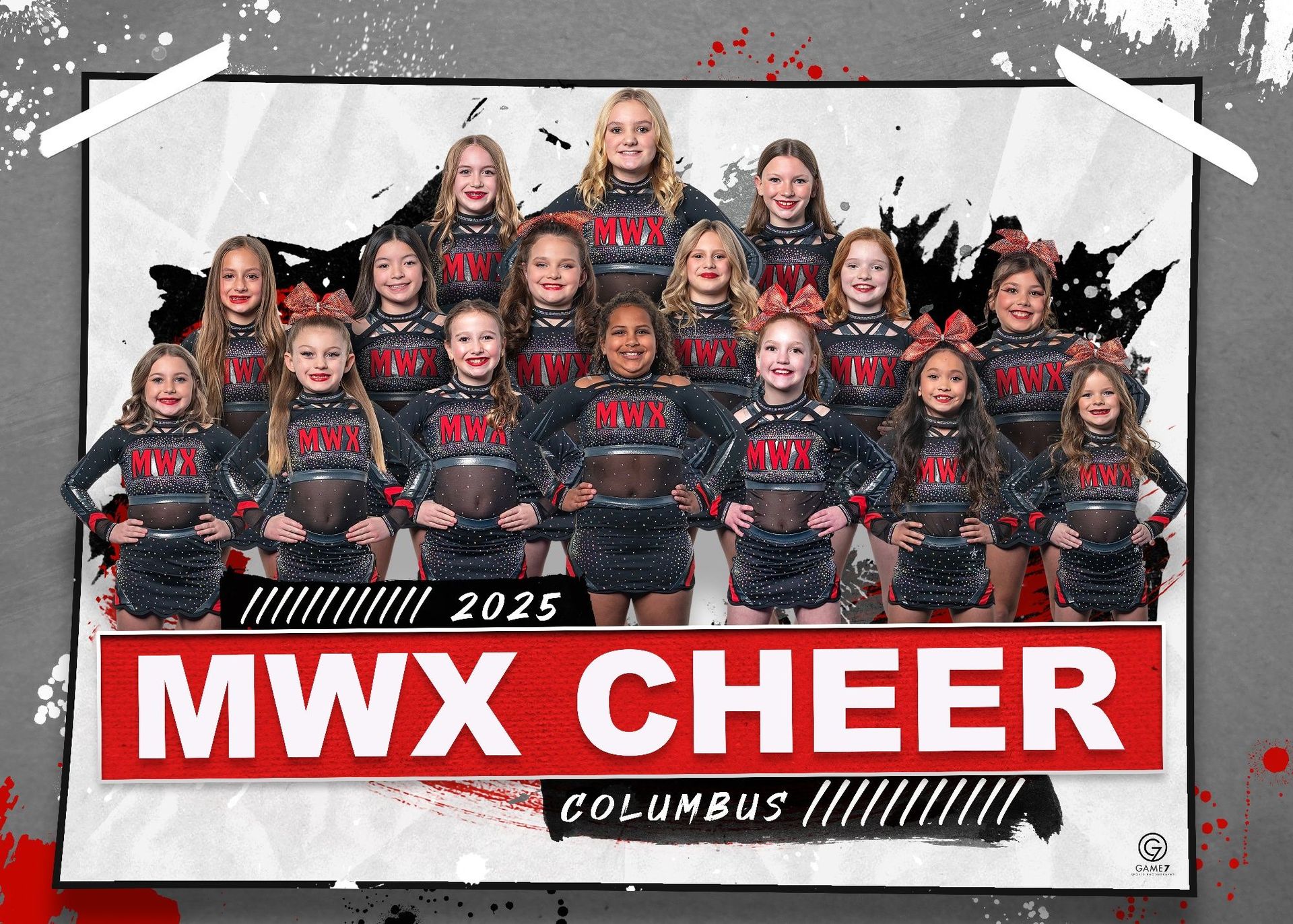 A group of cheerleaders are posing for a picture in front of a sign that says mwx cheer