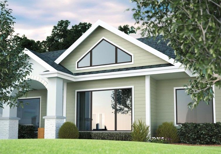 A house with a triangle shaped window on the roof