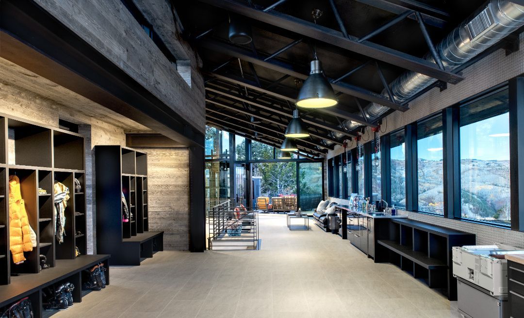 A large room with a lot of windows and lockers