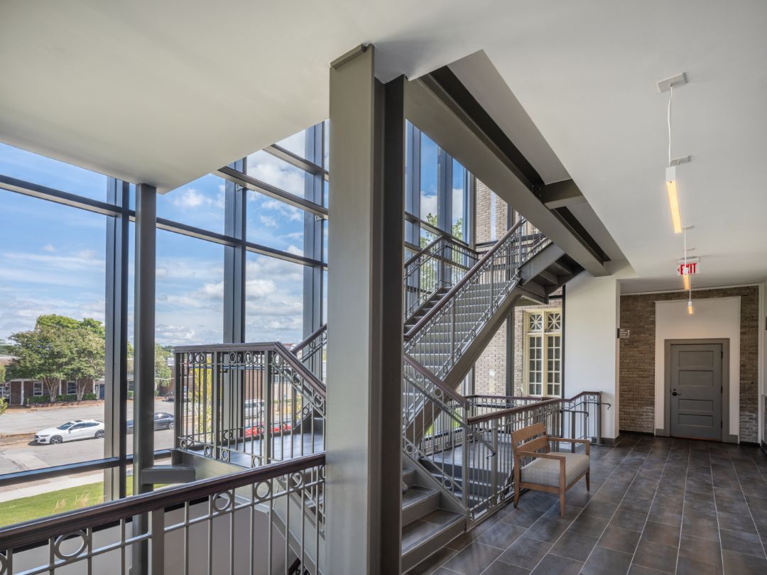 A staircase in a building with a lot of windows