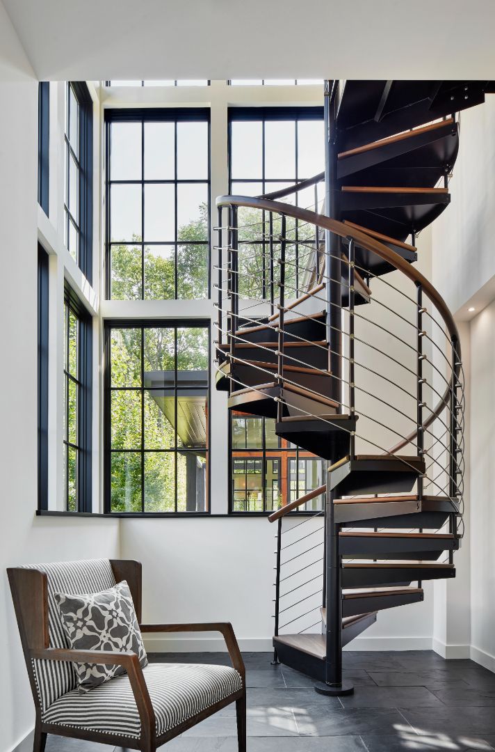 There is a spiral staircase in the middle of the room.