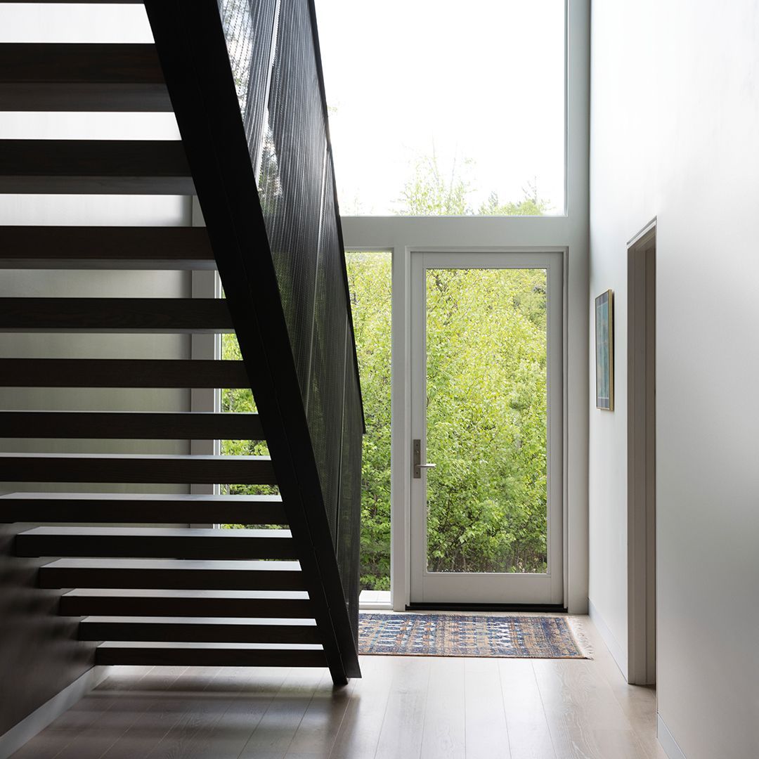 There is a staircase leading up to the second floor of a house.