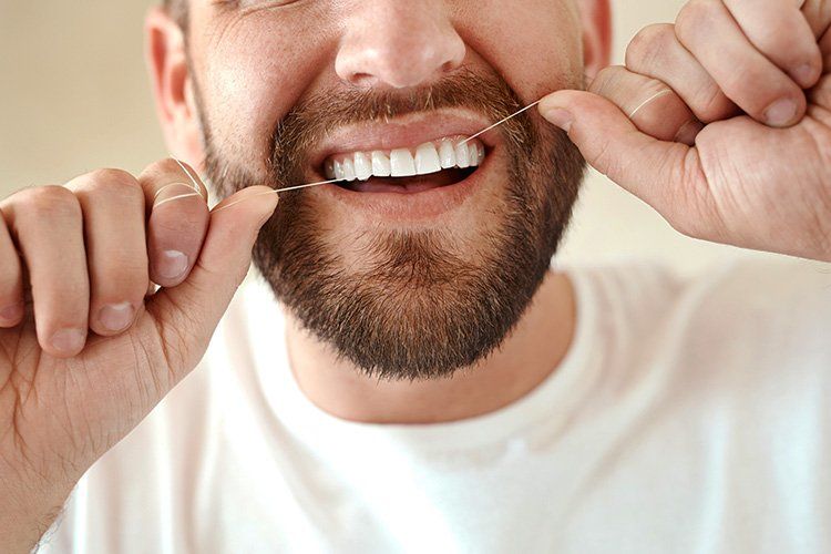 Man flossing