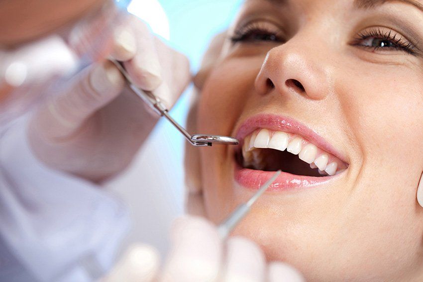Close up of woman receiving dental exma