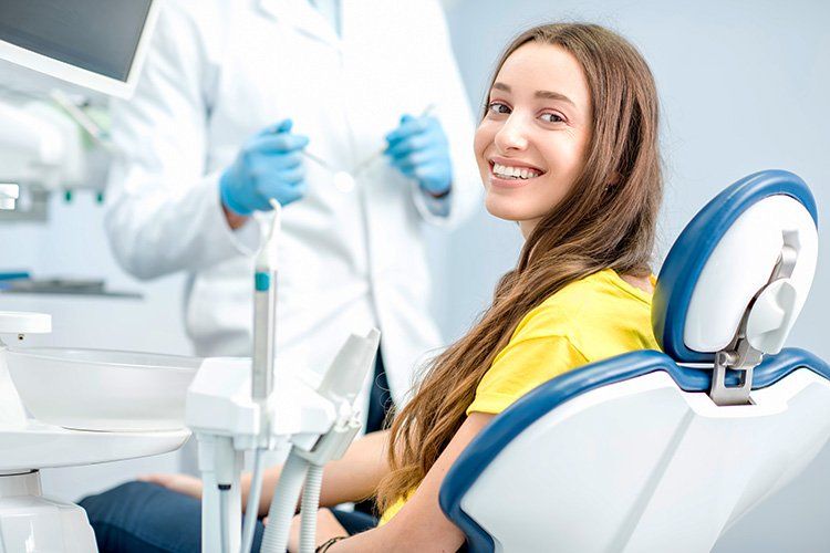 Young girl smiling before dental procedure