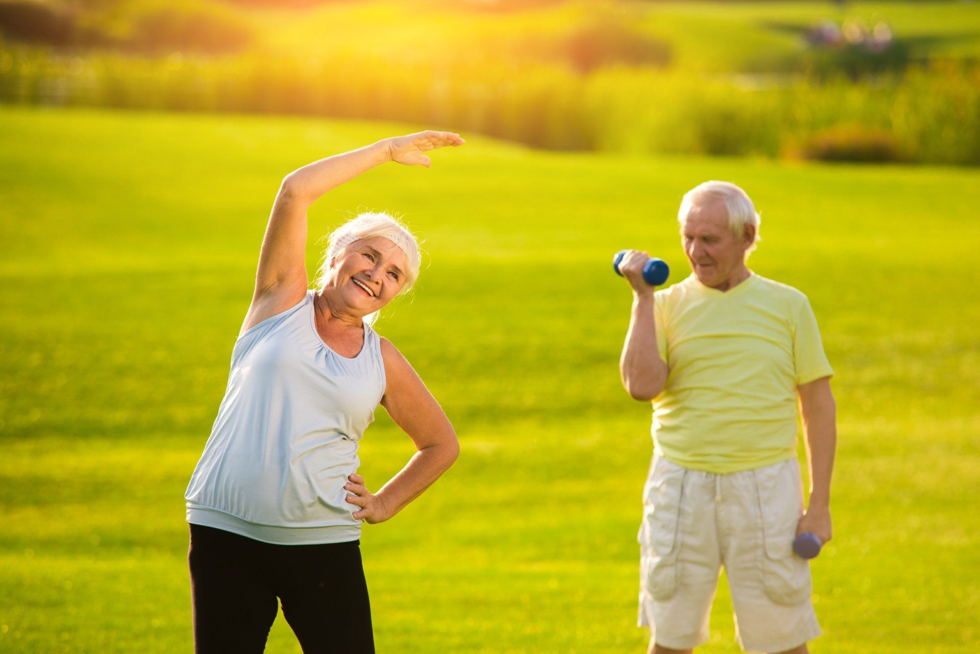 Elderly man and woman doing exercise