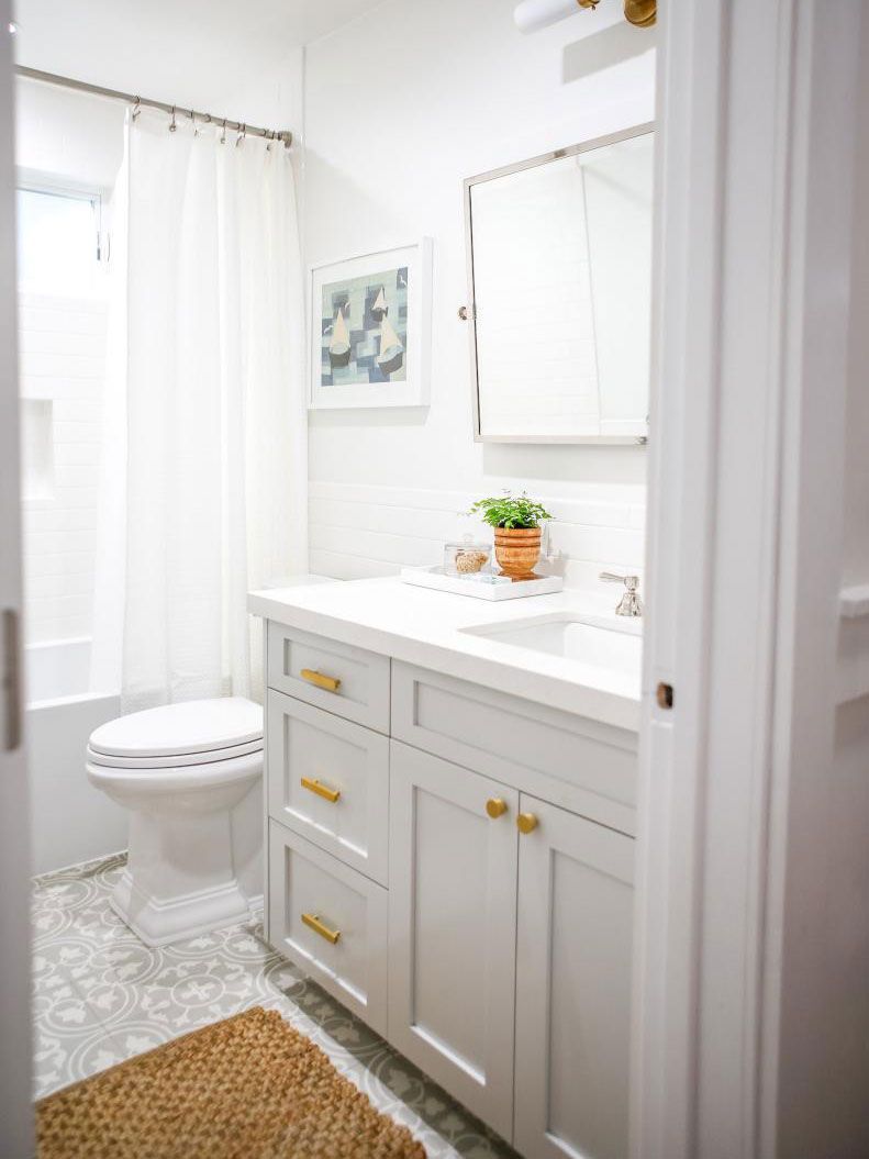 A bathroom with a sink , toilet , and mirror.