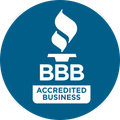 A bbb accredited business logo in a blue circle