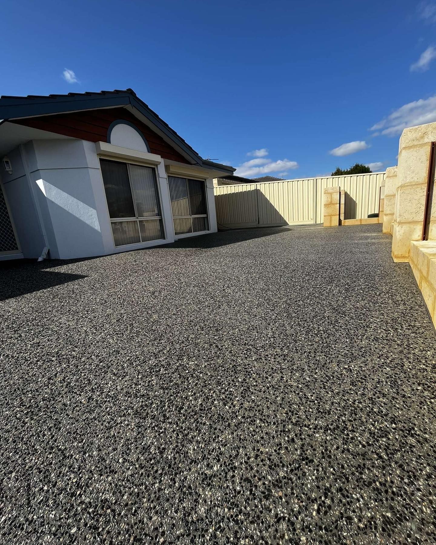 Concrete Driveway with exposed Geostone accents.