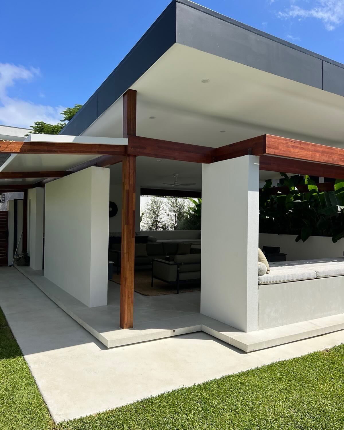 Burnished patio slab with a perimeter floating step and also featuring two floating concrete day bed