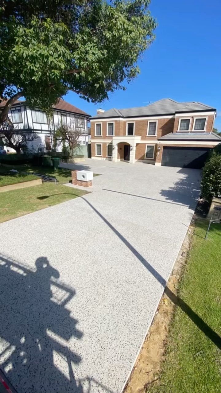 grey exposed aggregate driveway for large two storey home in Perth