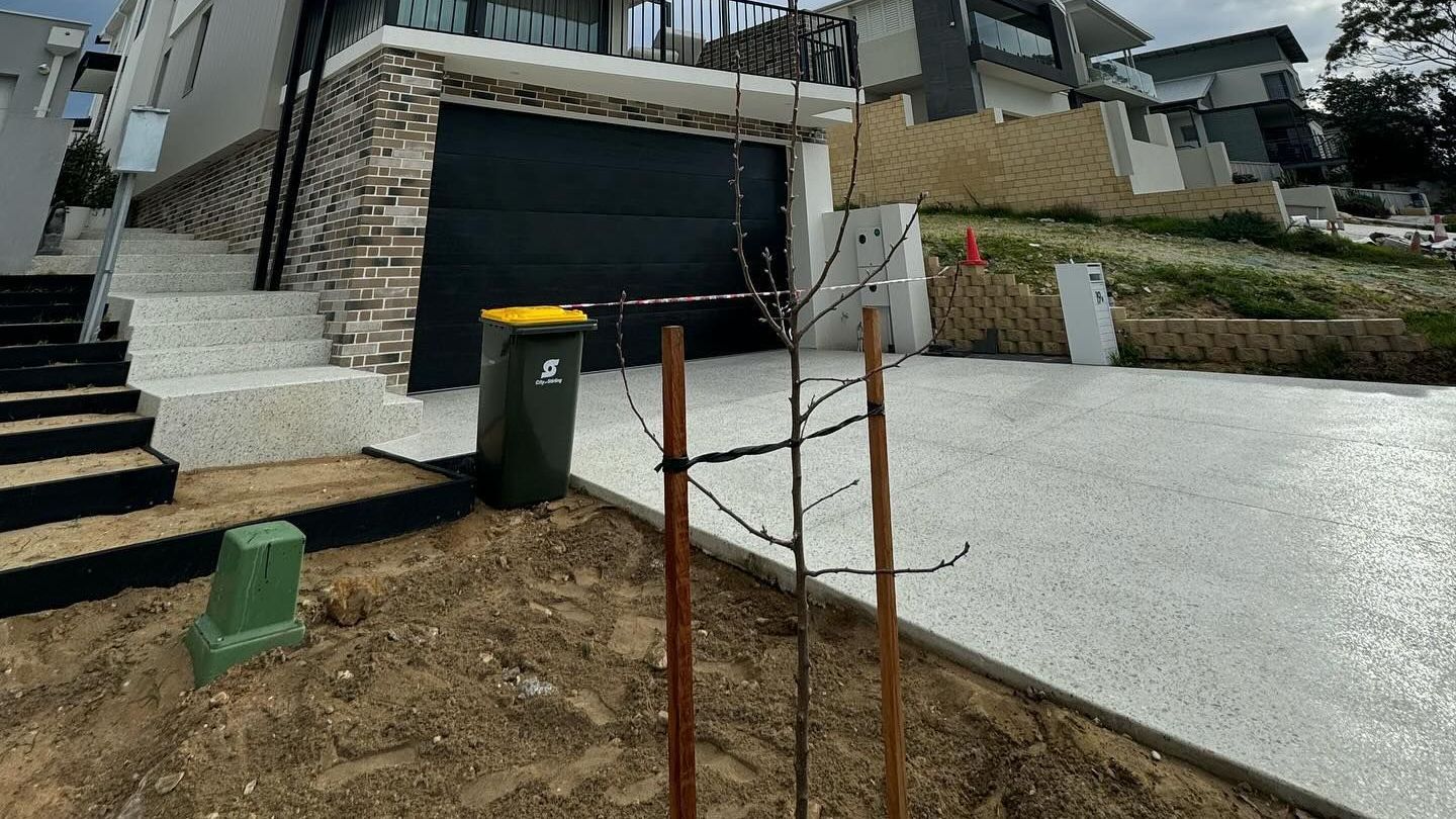 New concrete driveway and stairs from Handmade Concreting